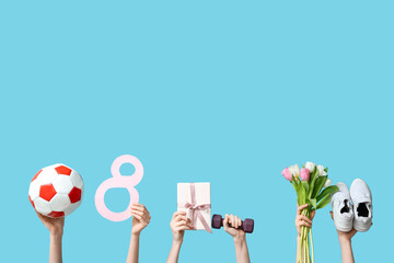 Female hands with sports equipment, shoes, gift box and tulip flowers for International Women's Day on color background