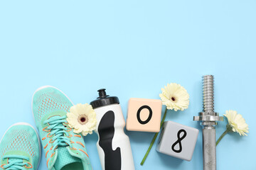 Composition with sports shoes, barbell grip, bottle of water and flowers on color background....