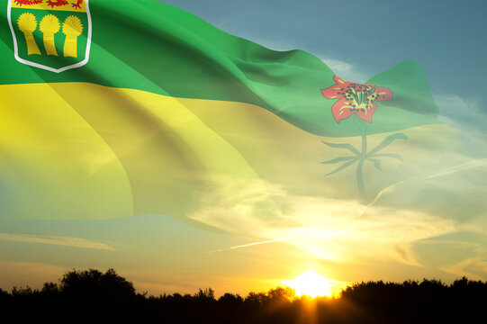 Flag of Saskatchewan against the sunset. Province of Canada