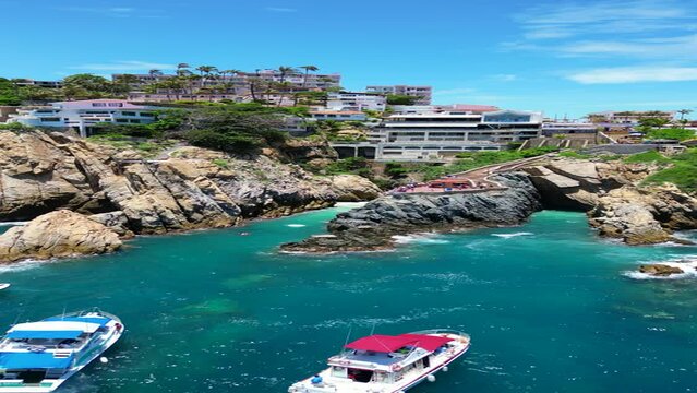 Sailing Serenity: Drone Footage Retreating from the Quebrada Over the Sea, Acapulco Mexico