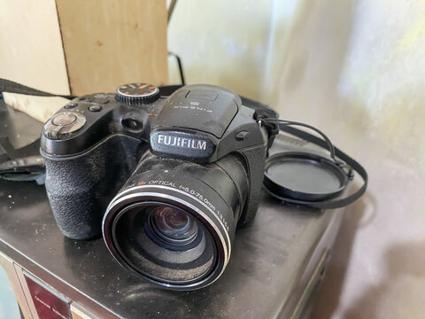 Yogyakarta, Indonesia - January 23, 2024: Old fashioned analog camera from famous brands belonging to a collector. Antiques are displayed on a rack or table as room decoration.