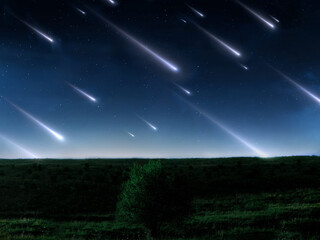 Meteor storm in the sky. Fireballs fly over a green hill. Dreamy night scenery. Beautiful starfall.