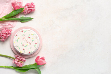 Obraz na płótnie Canvas Sweet bento cake and beautiful flowers on white background. International Women's Day