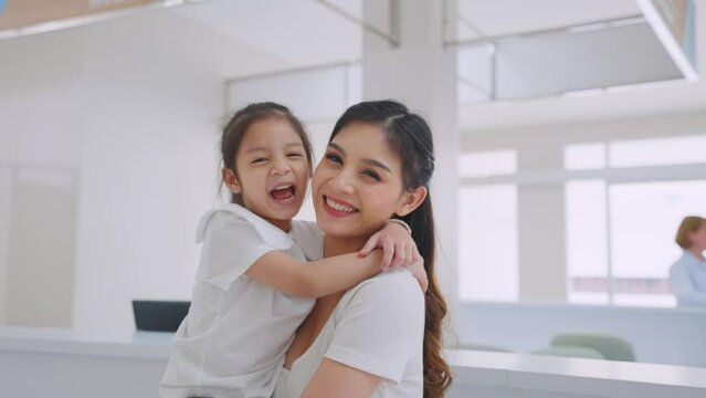 Portrait of Asian family patient standing in corridor at hospital ward. 