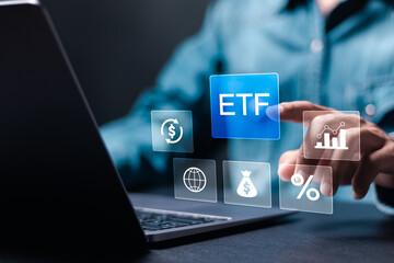 ETF, Exchange traded fund concept. Business stock market finance index fund. Businessman use laptop...