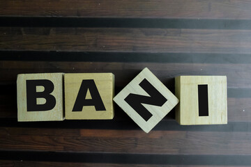 Concept of The wooden Cubes with the word BANI on wooden background.