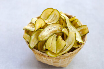 Banana chips, fried slices banana with green peel
