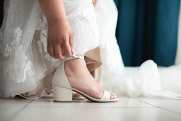 Obraz na płótnie Canvas Wedding shoes are a very important accessory of the bridal /groom wedding day, that matches with the full outfit dressed, material, style, color and height depends of culture