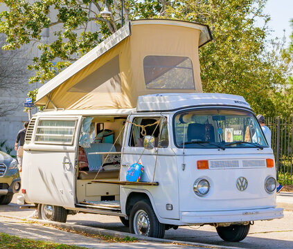 Parked Classic Volkswagen Westfalia Camper Van with Open Top on February 24, 2024 in New Orleans, LA, USA