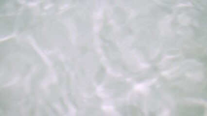 The surface of clear water with ripple waves in a white bathtub to water calm