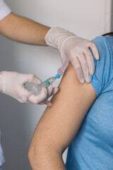 nurse giving a vaccine to a patient. Close-up