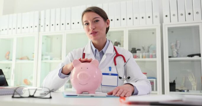 Saving money on healthcare costs and doctor with piggy bank