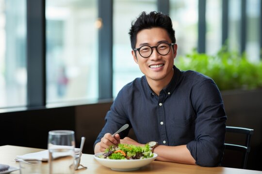 A Smiling Asian Man Enjoying a Fresh Salad at a Restaurant, Fictional Character Created By Generated AI.