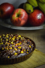 view of chocolate cake with hazelnuts, close up view of ice cream food background,