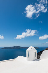 White architecture in Santorini island, Greece. View of the sea and the blue sky with clouds.