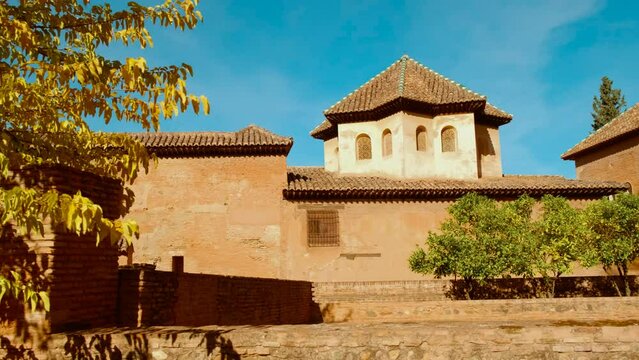The Alhambra Palace - Palace of Partal displaying exquisite Moorish architecture and lush vegetation in Granada, Andalucia, Spain