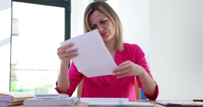 Upset stressed woman feeling disappointed reading letter with bad news