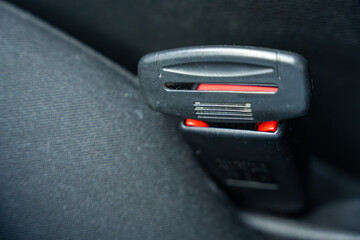Artificial seat belt plug.Violation of traffic rules. Irresponsible driving and behavior concept