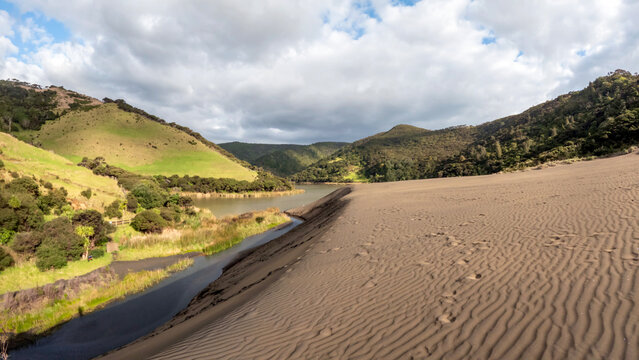 Black sand dunes of New Zealand's Waitakere Ranges, towering giant sand dune at Lake Wainamu