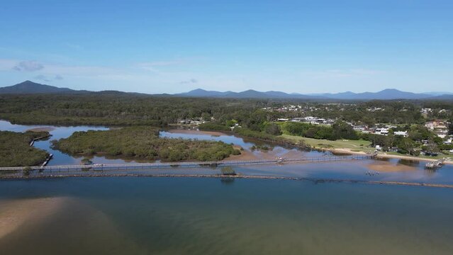 Urunga boardwalk aerial views inland past Urunga town and up the river valleys to the Great Dividing Range