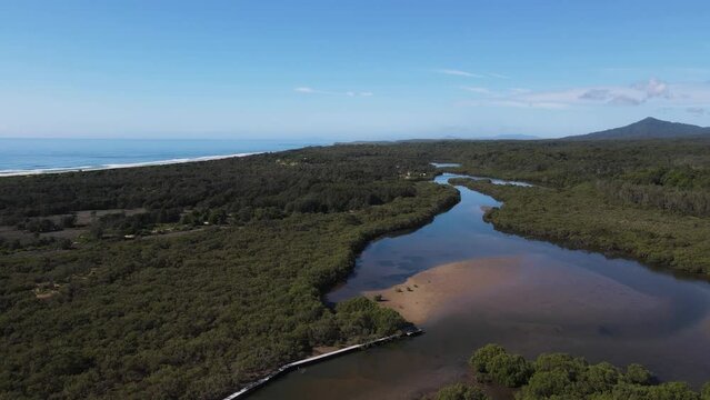Aerial views of Urunga boardwalk with stunning views up the Bellinger river the Great Dividing Range.