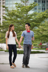 Happy Chinese couple walking together.