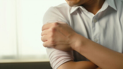Person Clutching Their Sore Elbow in Pain
