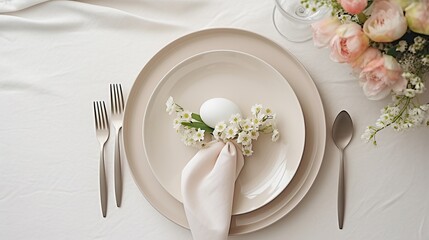 Elegant Easter table setting with a pure white egg and fresh white blossoms, symbolizing renewal and spring festivities.