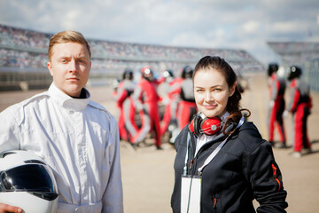 Race day readiness with drivers and team at the trackside. 