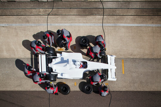 Pit crew in action during a highspeed race 