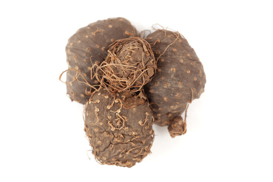 A pile of Dry Organic Varahikanda (Dioscorea bulbifera) fruit, isolated on a white background. Top view
