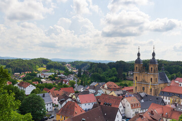 Fototapeta na wymiar Panorama view with pilgrimage site Basilica minor in Gößweinstein and townscape in Franconian Switzerland, Bavaria, Germany