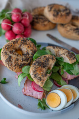 Bagel with cream cheese on wooden table - 747025449