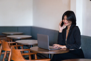 asian freelance people businesswoman talking making using smartphone casual working with laptop computer in cafe coffee shop background,business expressed confidence embolden and successful concept