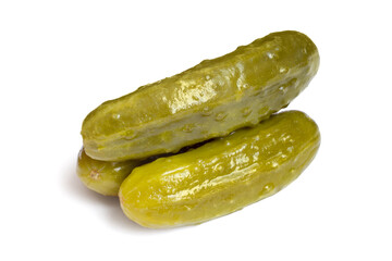Three pickles isolated on white background. Natural pickled cucumbers close-up.