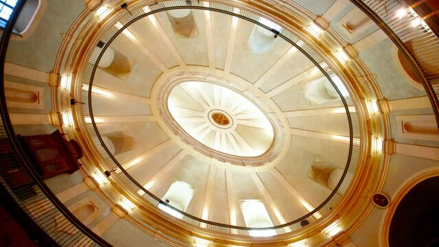 The stunning oval-shaped ceiling of the Iglesia del Oratorio de San Felipe Neri in Cadiz, Andalucia, Spain, with its elegant design
