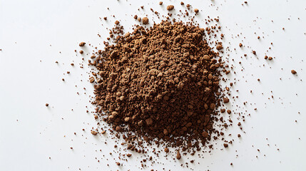 Soluble coffee is scattered on a white background.