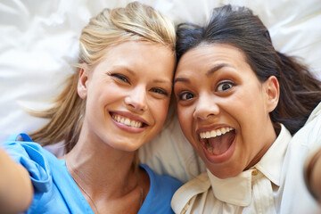 Women, selfie and smiles by friends on bed for profile picture, app and social media network for...