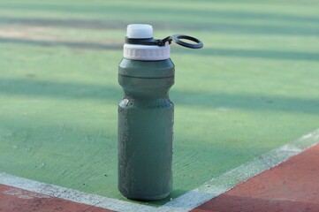 sports drinking bottles on the sports field