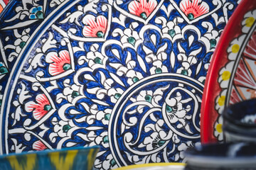 Multi-colored ceramic products with oriental ornaments at the Siab Bazaar in the ancient city of...