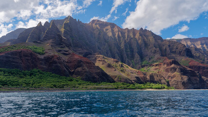 View from a tourist boat at stunning coast in the Napali Coast State Wilderness Park, Island of...