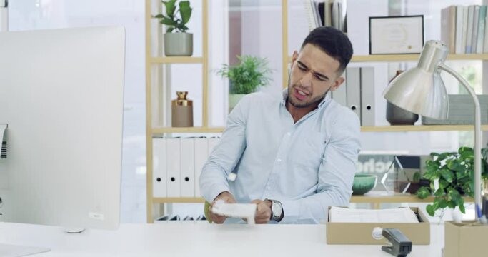 Frustrated businessman, angry and smashing keyboard at office on desk in destruction or violence. Man or employee in anger management, destroy or crisis with computer problems on table at workplace