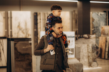 a father with a young son in a hardware store