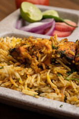Paneer tikka biryani with onion raitha, vegetable biryani, hyderabadi biryani, south indian biryani served in plate
