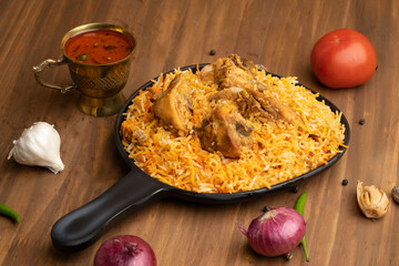 Restaurant style Spicy Chicken Biryani served with Raita and Salan, Popular Indian or Pakistani non vegetarian Food