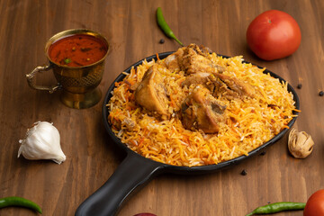 Restaurant style Spicy Chicken Biryani served with Raita and Salan, Popular Indian or Pakistani non vegetarian Food