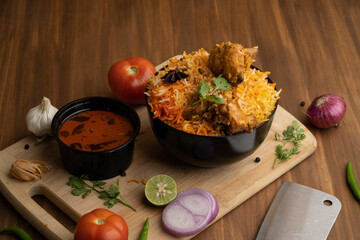 Restaurant style Spicy Chicken Biryani served with Raita and Salan, Popular Indian or Pakistani non vegetarian Food