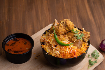 Restaurant style Spicy Chicken Biryani served with Raita and Salan, Popular Indian or Pakistani non vegetarian Food