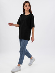 mockup of a black loose-fitting t-shirt on a young beautiful girl