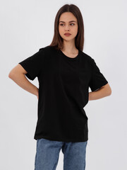 mockup of a black loose-fitting t-shirt on a young beautiful girl